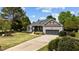 Charming single-Gathering home with a covered porch, attached garage, and manicured front yard at 503 Fish Pond Ct, Rolesville, NC 27571