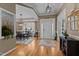 Gracious foyer featuring hardwood flooring, ample natural light, and an open view into the dining area at 503 Fish Pond Ct, Rolesville, NC 27571