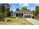 Inviting single-story home featuring a stone porch, tidy landscaping, a swing, and a convenient two-car garage at 503 Fish Pond Ct, Rolesville, NC 27571