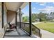 Charming covered front porch with dark support columns and railing, overlooking the landscaped front yard and street at 503 Fish Pond Ct, Rolesville, NC 27571