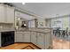 Kitchen with breakfast bar open to a sunny eat-in dining and living area at 503 Fish Pond Ct, Rolesville, NC 27571