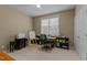 Bright office with a sewing machine, canvas, desk, office chair, and shelving at 503 Fish Pond Ct, Rolesville, NC 27571