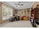 Spacious home office with an expansive desk, computer, shelves, and picture frame decor at 503 Fish Pond Ct, Rolesville, NC 27571