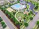 Aerial view of neighborhood pool, playground, volleyball court, landscaping and parking at 518 Retreat Ln, Wake Forest, NC 27587
