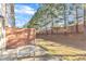 Backyard patio with mature trees and privacy fence at 518 Retreat Ln, Wake Forest, NC 27587