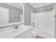 Clean bathroom featuring a single vanity, mirror, and bathtub with shower at 518 Retreat Ln, Wake Forest, NC 27587