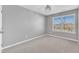 Carpeted bedroom featuring a window and neutral walls at 518 Retreat Ln, Wake Forest, NC 27587