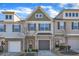 Charming multi-level townhome with inviting curb appeal and attached one car garage at 518 Retreat Ln, Wake Forest, NC 27587