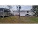 The backyard features a covered deck and satellite dish at 530 Broad Rd, Roxboro, NC 27573