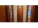 View of hallway with access to multiple rooms and natural wood doors at 530 Broad Rd, Roxboro, NC 27573