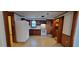 Charming kitchen with classic white appliances and dark wood cabinets at 530 Broad Rd, Roxboro, NC 27573