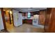 Well-lit kitchen features essential appliances and ample cabinet space at 530 Broad Rd, Roxboro, NC 27573