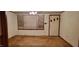 Living room featuring natural light from windows and neutral-toned carpet at 530 Broad Rd, Roxboro, NC 27573