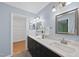 Large bathroom with double vanity, white countertops, and a well-lit space at 5610 Frenchmans Creek Dr, Durham, NC 27713