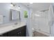 Bathroom featuring a shower, vanity with modern fixtures, and a window providing natural light at 5610 Frenchmans Creek Dr, Durham, NC 27713