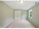 Bedroom with plush carpet, and a double door closet and a window for natural light at 5610 Frenchmans Creek Dr, Durham, NC 27713