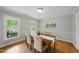 A dining room featuring hardwood floors and a neutral paint color at 5610 Frenchmans Creek Dr, Durham, NC 27713