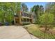 Two story home with well maintained yard, driveway and mature trees at 5610 Frenchmans Creek Dr, Durham, NC 27713