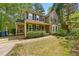 Two story home with well maintained yard, driveway and mature trees at 5610 Frenchmans Creek Dr, Durham, NC 27713