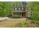 Charming two-story home featuring a welcoming front porch and well-maintained landscaping at 5610 Frenchmans Creek Dr, Durham, NC 27713