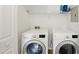 This laundry room features a front loading washing machine and a dryer at 5610 Frenchmans Creek Dr, Durham, NC 27713