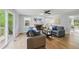 Spacious living room with a fireplace and large windows at 5610 Frenchmans Creek Dr, Durham, NC 27713