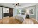 A cozy main bedroom with a barn door leading to an ensuite bathroom at 5610 Frenchmans Creek Dr, Durham, NC 27713