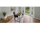 Bright and airy office with a bay window overlooking the lush greenery outside at 5610 Frenchmans Creek Dr, Durham, NC 27713