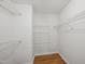 Walk-in closet with shelving, providing ample storage space at 5610 Frenchmans Creek Dr, Durham, NC 27713