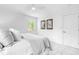 Bright bedroom featuring neutral tones, a ceiling fan, and views from the window at 5712 Wintergreen Dr, Raleigh, NC 27609