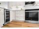 Bright kitchen featuring white cabinets, stainless steel appliances, subway tile backsplash, and quartz countertops at 5712 Wintergreen Dr, Raleigh, NC 27609