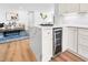 Bright kitchen featuring white cabinets, stainless steel appliances, subway tile backsplash, and quartz countertops at 5712 Wintergreen Dr, Raleigh, NC 27609