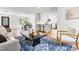 Living room flows to dining and kitchen. Features fireplace, stylish decor, and hardwood floors at 5712 Wintergreen Dr, Raleigh, NC 27609