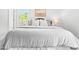Bright main bedroom featuring plush carpeting, a large bed, and neutral paint at 5712 Wintergreen Dr, Raleigh, NC 27609