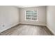 Comfortable bedroom with a bright window, and neutral color scheme at 5804 Falls Of Neuse Rd # E, Raleigh, NC 27609