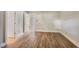 A view of this bedroom shows light-filled space and a hallway to the other rooms at 5804 Falls Of Neuse Rd # E, Raleigh, NC 27609