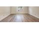 Bright bedroom with a large window and neutral walls, offering a calming space at 5804 Falls Of Neuse Rd # E, Raleigh, NC 27609