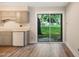 Efficient kitchen layout with sliding glass doors that open to the backyard at 5804 Falls Of Neuse Rd # E, Raleigh, NC 27609