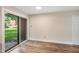 A well lit living room features sliding glass doors to a private patio at 5804 Falls Of Neuse Rd # E, Raleigh, NC 27609