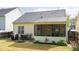 Picture of the backyard with a patio and a cozy screened-in porch perfect for outdoor living at 59 Tuscarora Ln, Clayton, NC 27520