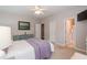 Bedroom with a queen bed, blue dresser, and a door to the bathroom at 59 Tuscarora Ln, Clayton, NC 27520