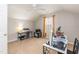 Bedroom with office desk, ceiling fan, and natural light from window at 59 Tuscarora Ln, Clayton, NC 27520