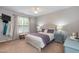 Comfortable bedroom with carpet, queen bed, and natural light from a window at 59 Tuscarora Ln, Clayton, NC 27520