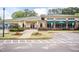 Community clubhouse with ample parking, verdant plantings, and covered entrance at 59 Tuscarora Ln, Clayton, NC 27520