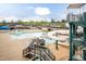 A view of the community pool area with slides, seating, and landscaping at 59 Tuscarora Ln, Clayton, NC 27520
