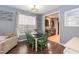Cozy dining area with green chairs and view to kitchen at 59 Tuscarora Ln, Clayton, NC 27520