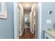 Hallway with hardwood floors and doorways leading to other rooms at 59 Tuscarora Ln, Clayton, NC 27520