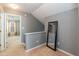 Upstairs hallway featuring a mirror and an open doorway to another room at 59 Tuscarora Ln, Clayton, NC 27520