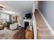 Spacious living room with hardwood floors, staircase, fireplace, and an open floor plan at 59 Tuscarora Ln, Clayton, NC 27520