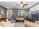 Cozy living room with hardwood floors, fireplace, and an open layout with natural light at 59 Tuscarora Ln, Clayton, NC 27520